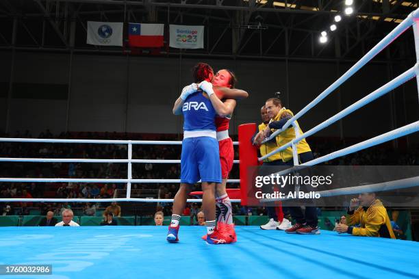 Tatiana de Jesus of Team Brazil and Yeni Arias of Team Colombia hug after competing on Boxing - Women's 54kg final bout at Centro de Entrenamiento...