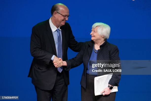 Secretary of Treasury Janet Yellen shakes hands with Inter-American Development Bank President, Ilan Goldfajn, during the Americas Partnership - IDB...