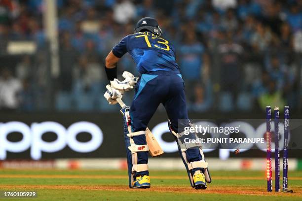 Sri Lanka's captain Kusal Mendis is clean bowled by India's Mohammed Siraj during the 2023 ICC Men's Cricket World Cup one-day international match...