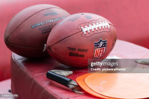 November 2023, Hesse, Frankfurt/Main: American Football: NFL, Before the season game Kansas City Chiefs vs. Miami Dolphins in Frankfurt: Balls with...