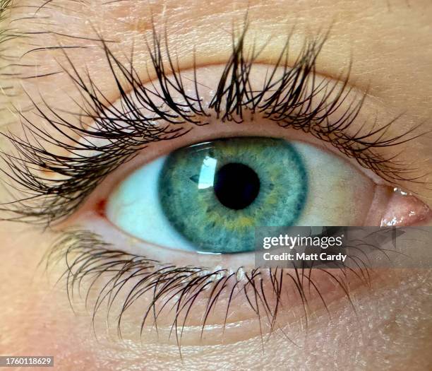 Close up of the green iris and pupil in the eye of a teenage boy is seen, on October 26, 2023 in Swansea, Wales. Green eyes are the rarest eye colour...