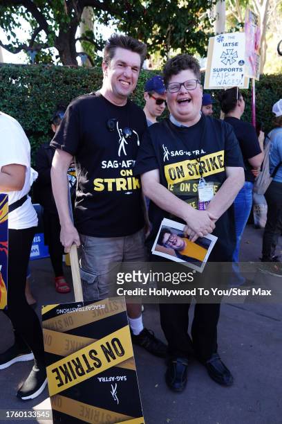 Devlin Wilder and Jesse Heiman walk the picket line at the SAG-AFTRA strike on November 1, 2023 at Warner Brothers Studios in Burbank, California.