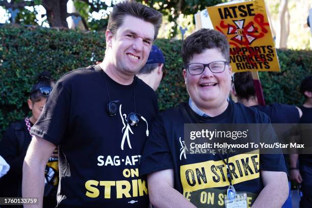 Devlin Wilder and Jesse Heiman walk the picket line at the SAG-AFTRA strike on November 1, 2023 at Warner Brothers Studios in Burbank, California.