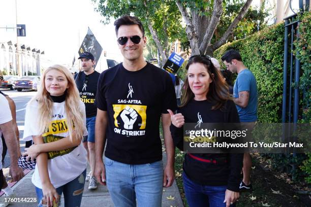 Samantha Bailey, Kash Hovey and Kira Reed Lorsch walk the picket line at the SAG-AFTRA strike on November 1, 2023 at Warner Brothers Studios in...