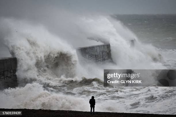 Waves crash the harbour wall in Newhaven, southern England on November 2 as strong winds and heavy rain from Storm Ciaran hit Britain. High winds and...