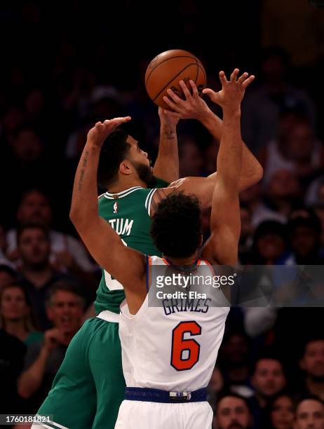 Jayson Tatum of the Boston Celtics heads for the net as Quentin Grimes of the New York Knicks defends at Madison Square Garden on October 25, 2023 in...