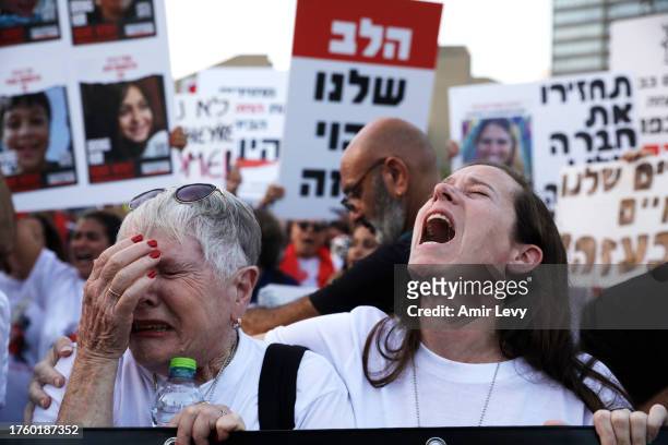 Woman weeps and another shouts as family and friends of hostages taken from Kfar Aza demonstrate in Tel Aviv museum plaza on November 2, 2023 in Tel...