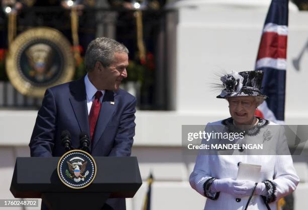 Britain's Queen Elizabeth II and US President George W. Bush participate in an official welcome ceremony on the South Lawn of the White House 07 May...