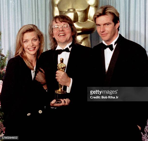 Oscar Winner Director Barry Levinson with Actress Michelle Pfeiffer and Actor Dennis Quaid backstage at the 61st Annual Academy Awards Show, March...