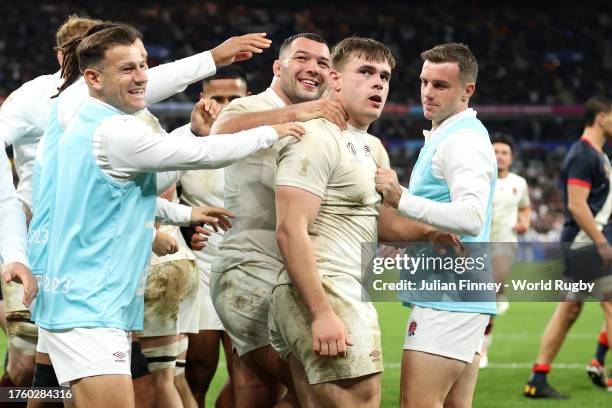 Theo Dan of England celebrates with teammates after scoring his team's second try during the Rugby World Cup France 2023 Bronze Final match between...