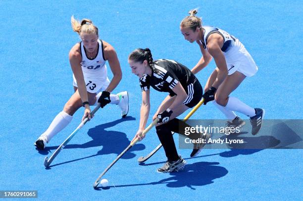 Ashley Hoffman, Emma Deberdine and Madeleine Zimmer of Team USA against Team Trinidad and Tobago at Women's Field Hockey at Centro Deportivo de...