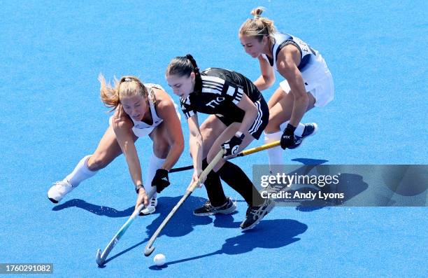 Ashley Hoffman, Emma Deberdine and Madeleine Zimmer of Team USA against Team Trinidad and Tobago at Women's Field Hockey at Centro Deportivo de...