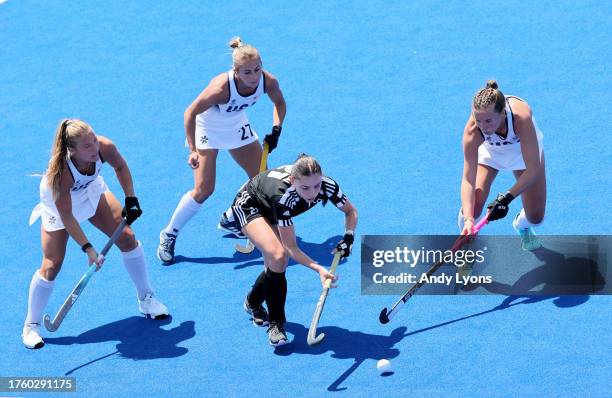 Ashley Hoffman, Emma Deberdine and Madeleine Zimmer of Team USA against Team Trinidad and Tobago at Women's Field Hockey at Centro Deportivo de...