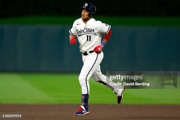 Jorge Polanco of the Minnesota Twins rounds the bases on his three-run home run against the Cleveland Guardians in the fourth inning at Target Field...