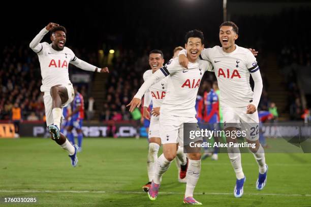 Son Heung-Min of Tottenham Hotspur celebrates with teammates Emerson and Brennan Johnson of Tottenham Hotspur after scoring the team's second goal...