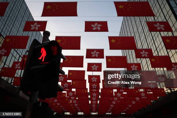 Chinese flags and Hong Kong flags are hung in Tsim Sha Tsui district on October 4, 2023 in Hong Kong, China. The Chinese government imposed a...