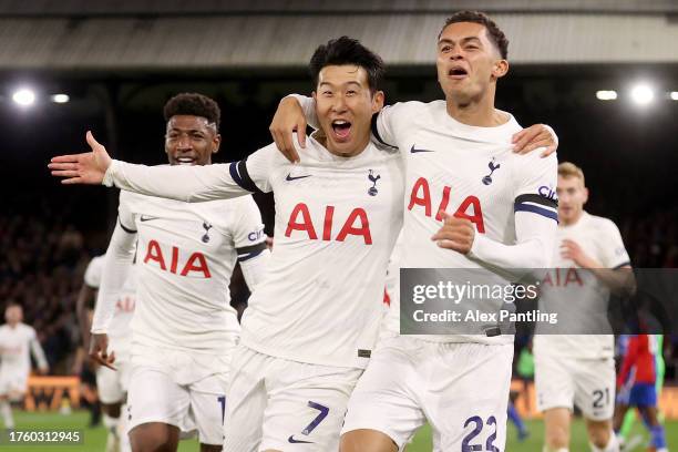 Son Heung-Min of Tottenham Hotspur celebrates with teammate Emerson and Brennan Johnson of Tottenham Hotspur after scoring the team's second goal...