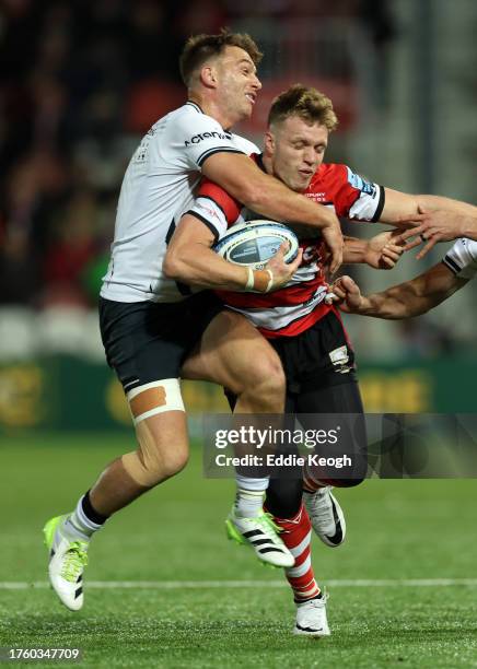 Ollie Thorley of Gloucester Rugby is tackled by Alex Lewington of Saracens during the Gallagher Premiership Rugby match between Gloucester Rugby and...