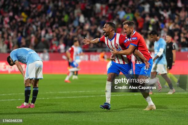 Yangel Herrera of Girona FC celebrates with teammate Cristhian Stuani after scoring the team's first goal during the LaLiga EA Sports match between...