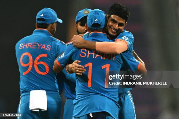 India's Shubman Gill celebrates with teammates after their win at the end of the 2023 ICC Men's Cricket World Cup one-day international match against...