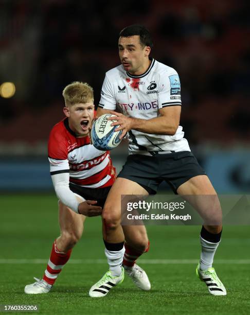 George Barton of Gloucester Rugby challenges Alex Lozowski of Saracens during the Gallagher Premiership Rugby match between Gloucester Rugby and...