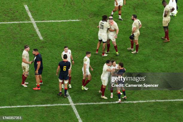 The teams shake handsfollowing the final whistle during the Rugby World Cup France 2023 Bronze Final match between Argentina and England at Stade de...