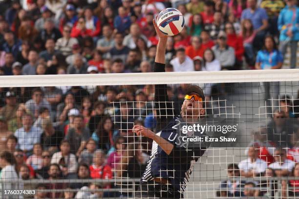 Logan Webber of Team United States jumps to spike the ball during a Beach Volleyball - Men's Bronze medal match between of Team United States and...