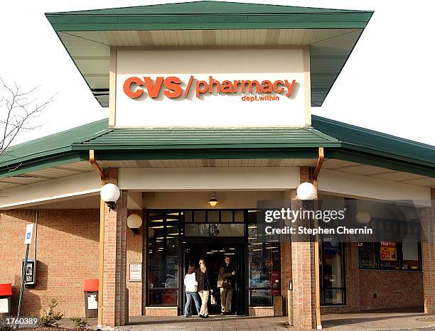 Customers leave a CVS store February 3, 2003 in Suffern, New York. CVS Corp. Posted a fourth quarter profit February 4 reporting earnings of $200.1...