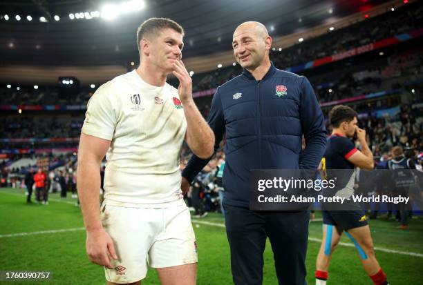 Owen Farrell of England and Steve Borthwick, Head Coach of England, interact at full-time following their team's victory in the Rugby World Cup...