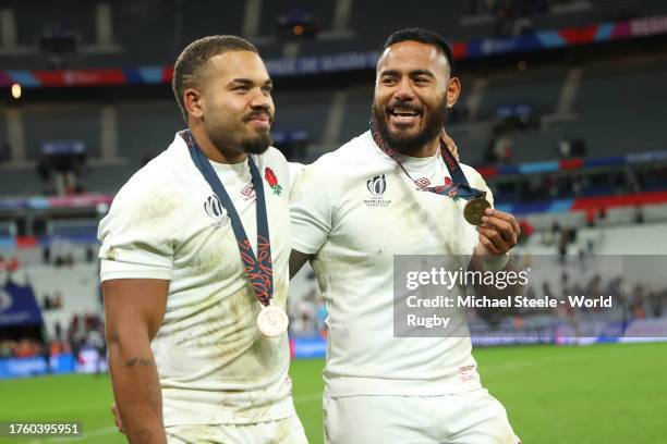 Ollie Lawrence and Manu Tuilagi of England celebrate victory at full-time following the Rugby World Cup France 2023 Bronze Final match between...