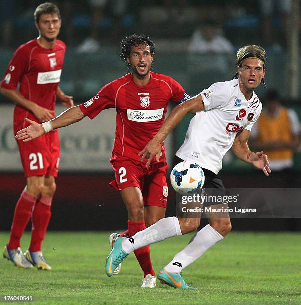 Federico Gerardi of Reggina competes for the ball with Emanuele Pesoli of Carpi during Tim Cup match between Reggina Calcio and Carpi F.C. 1909 at...