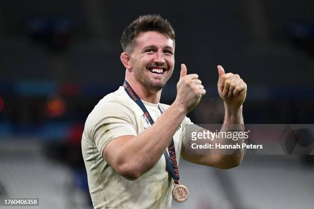 Tom Curry of England celebrates wearing his Bronze medal following the team's victory during the Rugby World Cup France 2023 Bronze Final match...