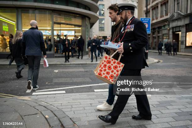 Ahead of Remembrance Day, members of the British Royal Navy are in the City to collect donations for the Royal British Legion's Poppy Appeal, in the...