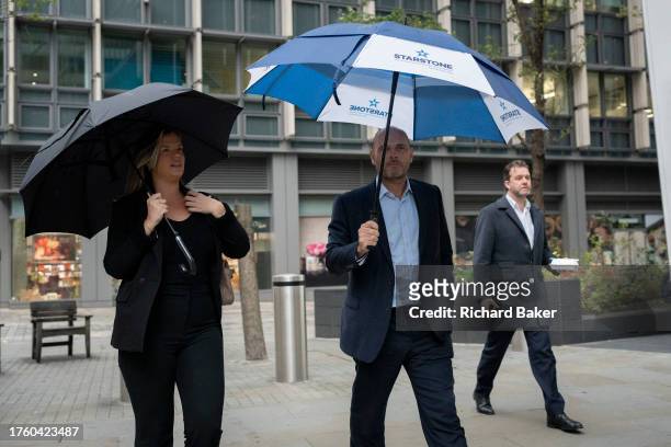 Business people walk through the City of London, the capital's financial district, on 2nd November 2023, in London, England.