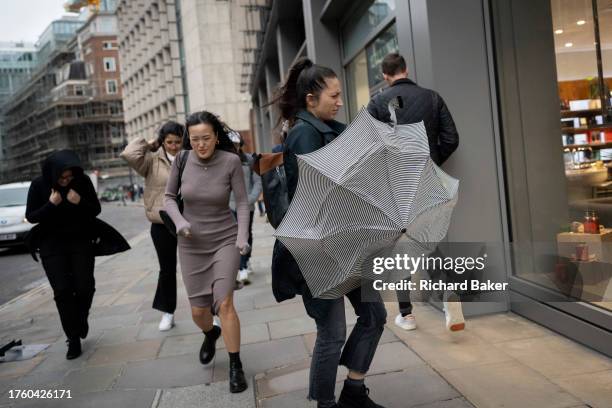 Pedestrians cope with strong winds during Storm Ciaran, in the City of London, the capital's financial district, on 2nd November 2023, in London,...