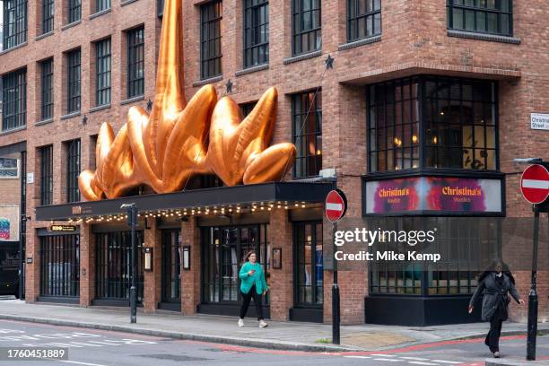 Large gold inflatable artwork outside the Dani Garcia Bibo Spanish restaurant in on 18th October 2023 in London, United Kingdom.