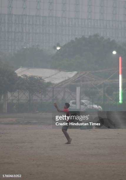 People out on a smoggy evening amid rising air pollution levels in sector 21, on November 2, 2023 in Noida, India. The Air Quality Index remained in...