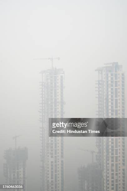 View of the city in smog amid rising air pollution levels, on November 2, 2023 in Noida, India. The Air Quality Index remained in the "very poor"...