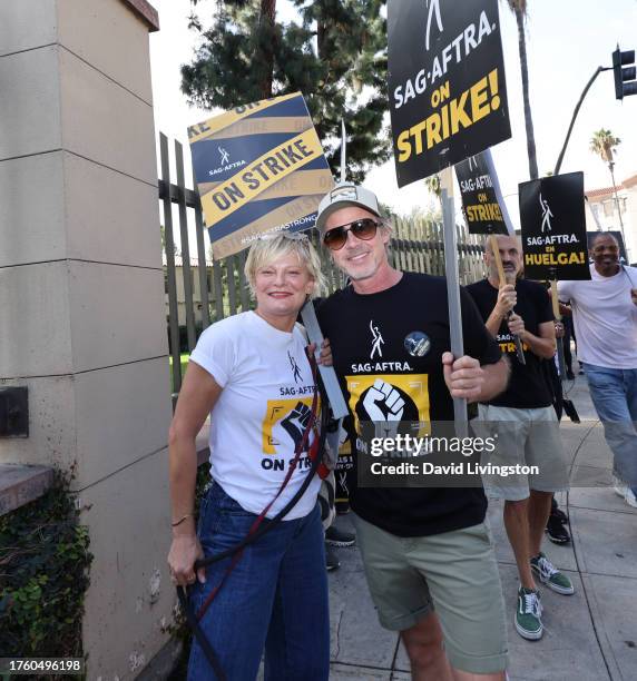 Martha Plimpton and Sam Trammell join the picket line outside Warner Bros. Studios on October 27, 2023 in Burbank, California. SAG-AFTRA has been on...