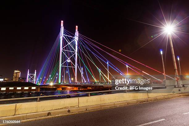 nelson mandela bridge at night, braamfontein, johannesburg, south africa - johannesburg south africa stock pictures, royalty-free photos & images