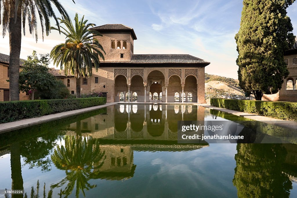 Alhambra Palace with perfect reflection in Granada, Spain