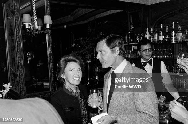 Berthe Jourdan and Louis Jourdan attend a party, celebrating the publication of Alexander Walker's "The Shattered Silents," at the Bistro restaurant...