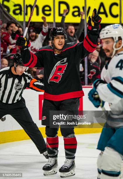 Teuvo Teravainen of the Carolina Hurricanes celebrates with teammates after a goal during the first period against the San Jose Sharks at PNC Arena...