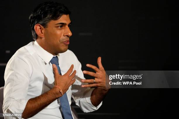 Britain's Prime Minister Rishi Sunak gestures during an in-conversation event with Tesla and SpaceX's CEO Elon Musk at Lancaster House on November 2,...