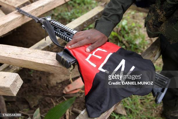 Detail of the weapon of a rebel of the National Liberation Army patrol near the Baudo river in Choco province, Colombia on October 26, 2023. In the...
