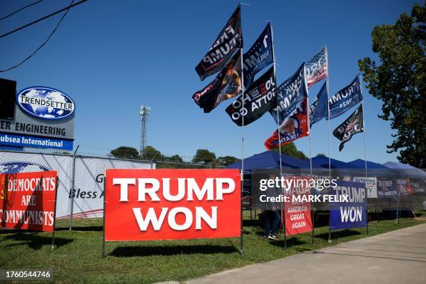 Vendor sells t-shirts and flags outside a rally of former US president and 2024 presidential hopeful Donald Trump at Trendsetter Engineering, Inc. In...