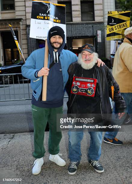 Dylan O'Brien and Radioman are seen at the SAG-AFTRA picket line outside the Netflix building on November 02, 2023 in New York City.