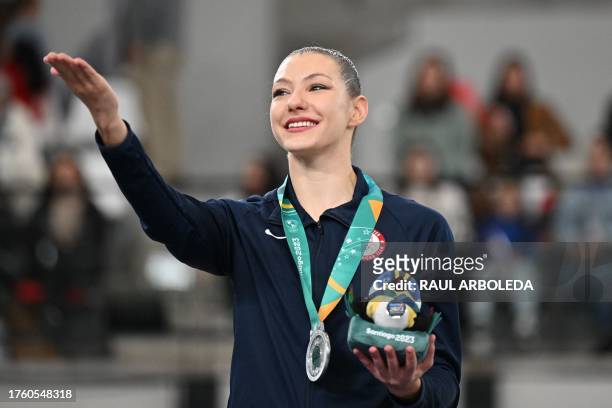 Evita Griskenas stands in the podium with her silver medal in the rhythmic gymnastics individual ribbon qualification of the Pan American Games...