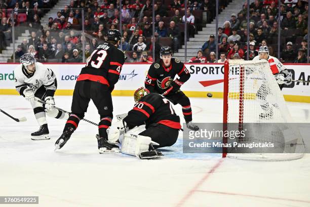 Phillip Danault of the Los Angeles Kings shoots the puck past goaltender Joonas Korpisalo of the Ottawa Senators during the first period at Canadian...