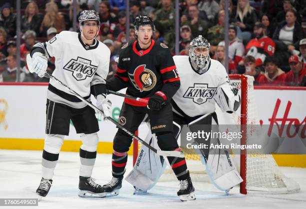 Drake Batherson of the Ottawa Senators battles for position against Pierre-Luc Dubois of the Los Angeles Kings in front of the net of Cam Talbot at...